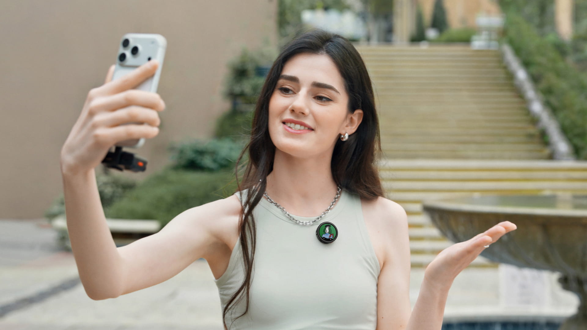 Creator wearing an Insta360 Mic Pro transmitter while recording